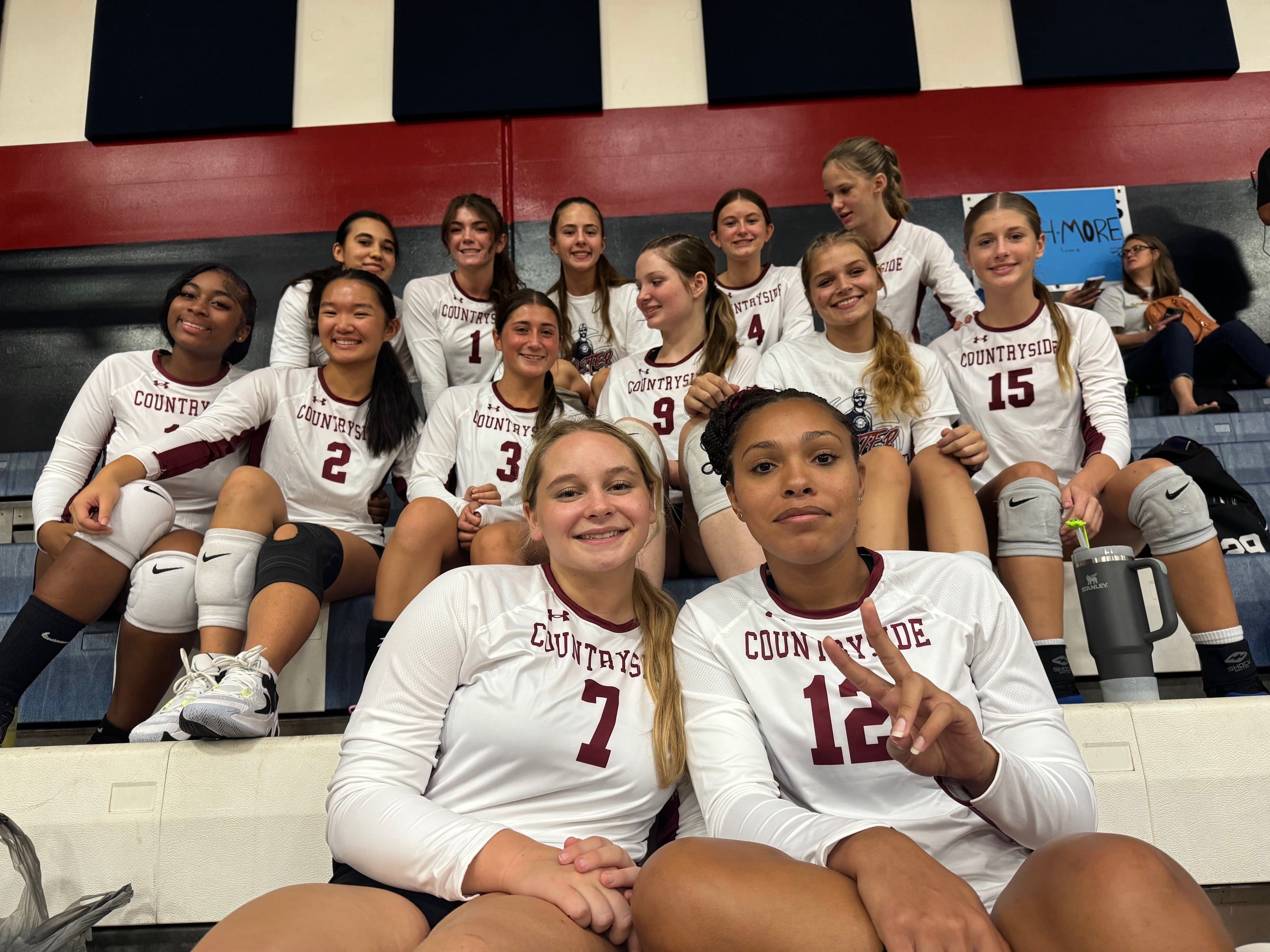 Countryside High School volleyball team in gym stands