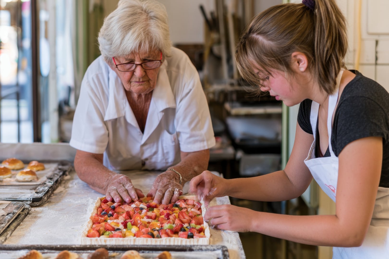 2 women making a pie in a bakery shop